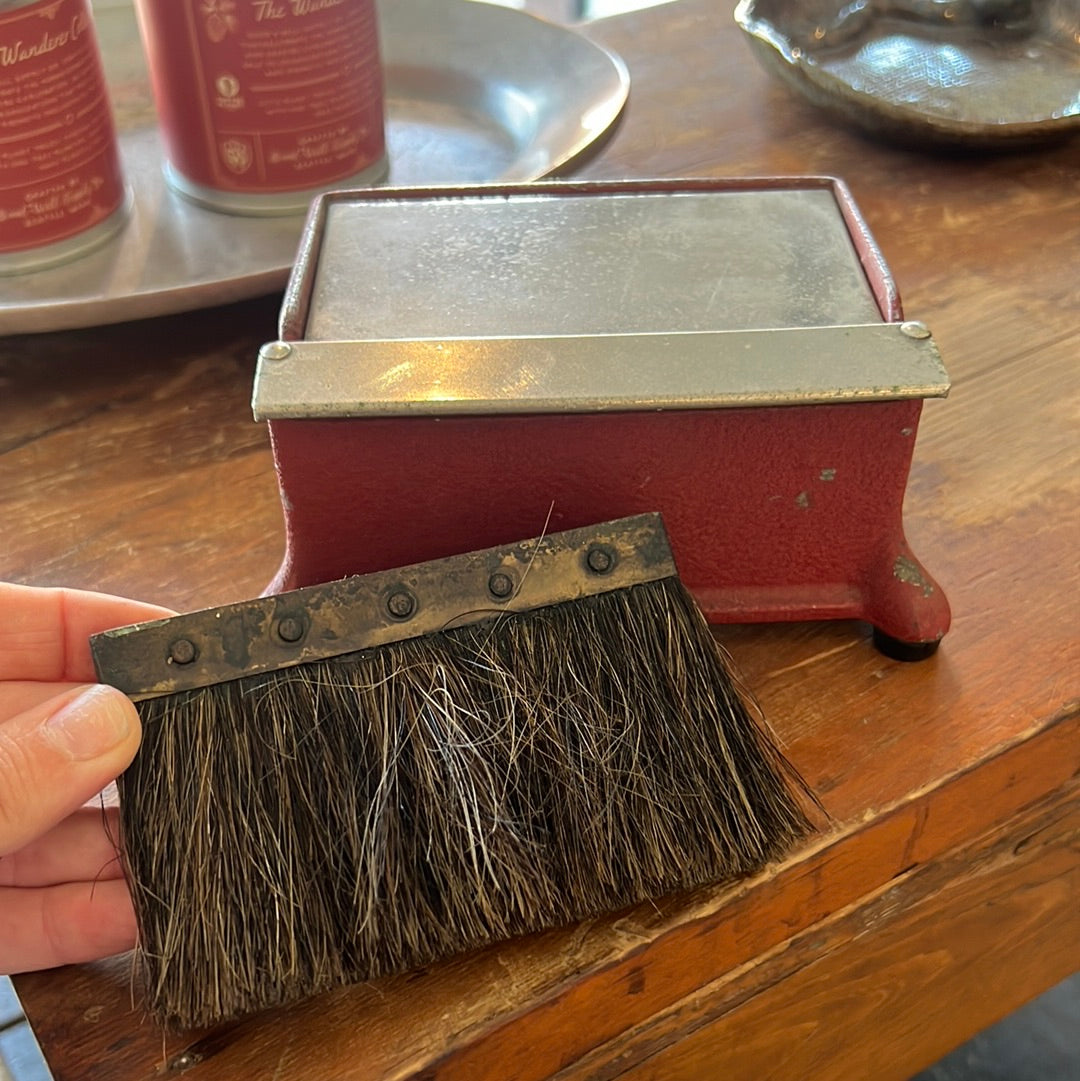 Vintage cast iron case with brush