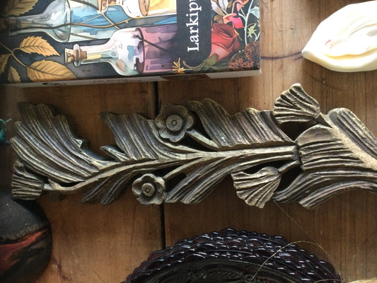 Carved wood floral wall piece